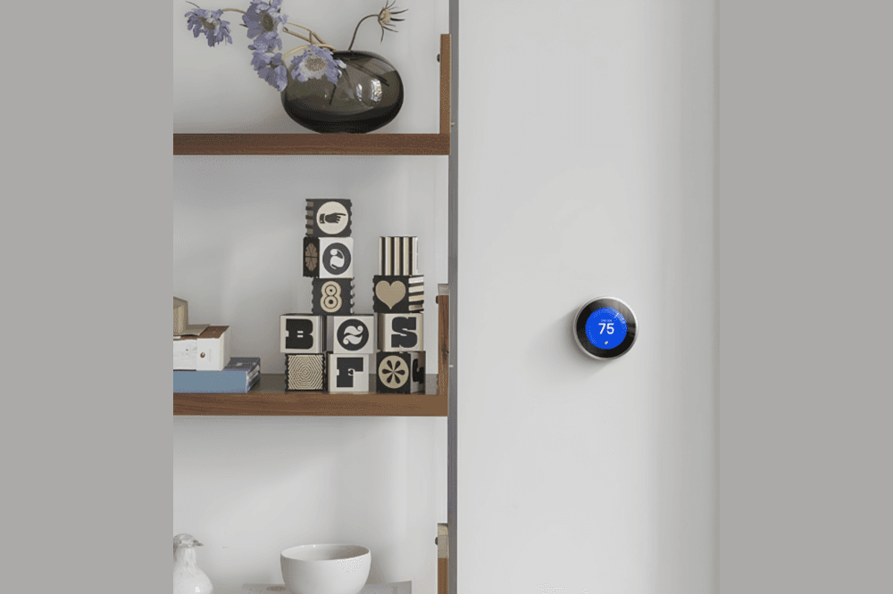 smart thermostat next to bookshelf