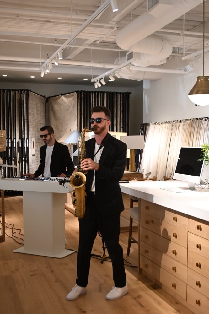 Knox Signature DJ, a DJ and saxophone duo, performs at the VIP opening event June 24.