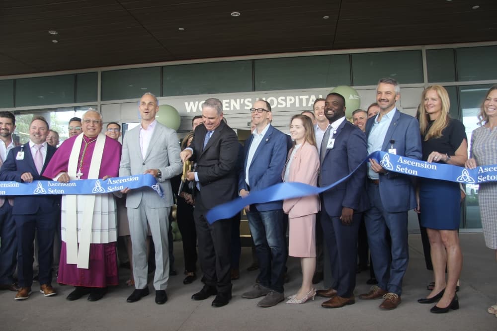 Staff gathers outside the new Ascension Seton Women's Hospital for the ribbon cutting ceremony June 25. (Ben Thompson/Community Impact)