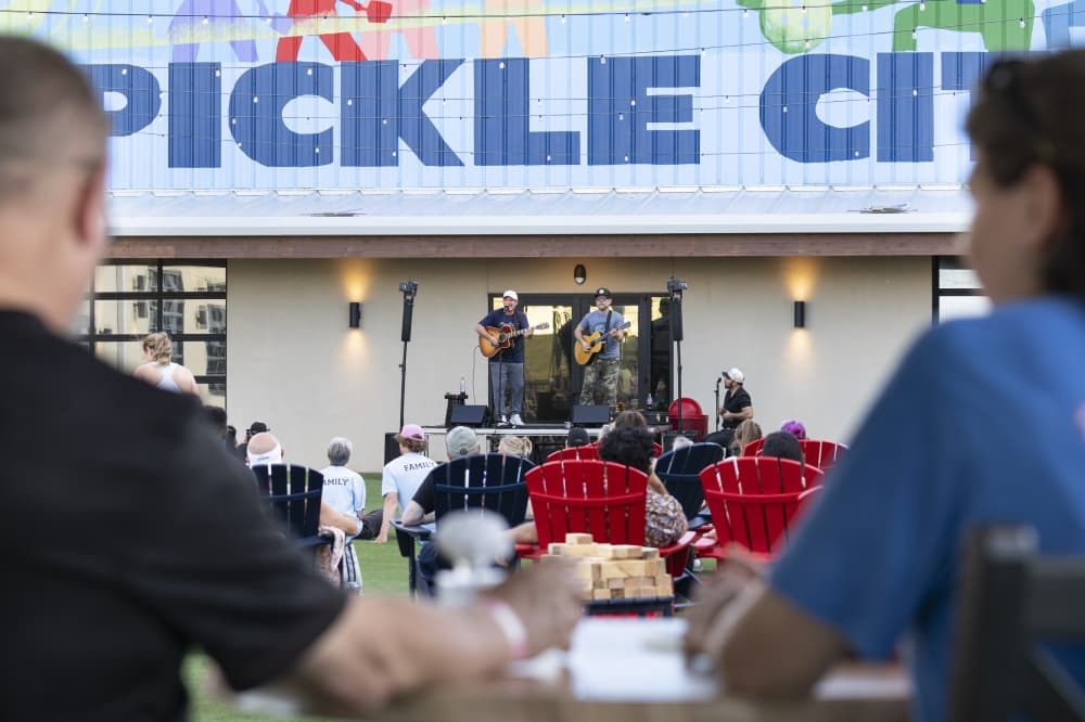 pickle city usa visitors watching a concert