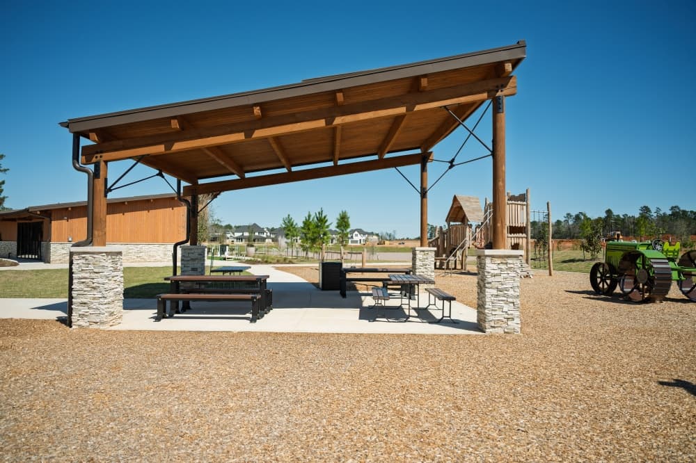 Walking trails, lake and outdoor amenities at Clopton Farms, a master-planned community with new construction homes in Montgomery, Texas.