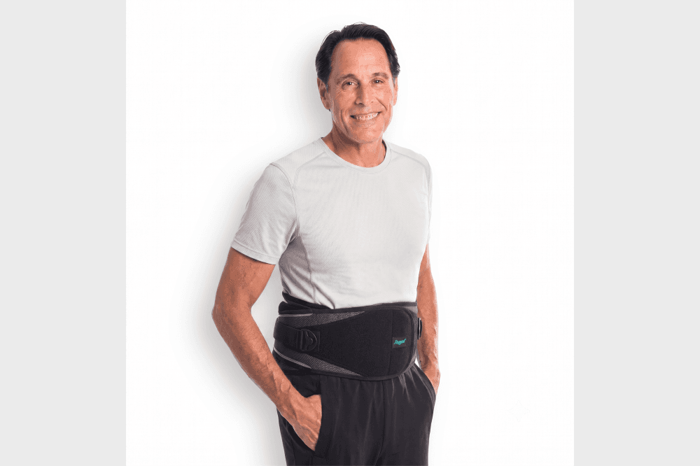 Medical professional adjusting a custom orthopedic back brace to provide spinal support and improve mobility for a patient with back pain