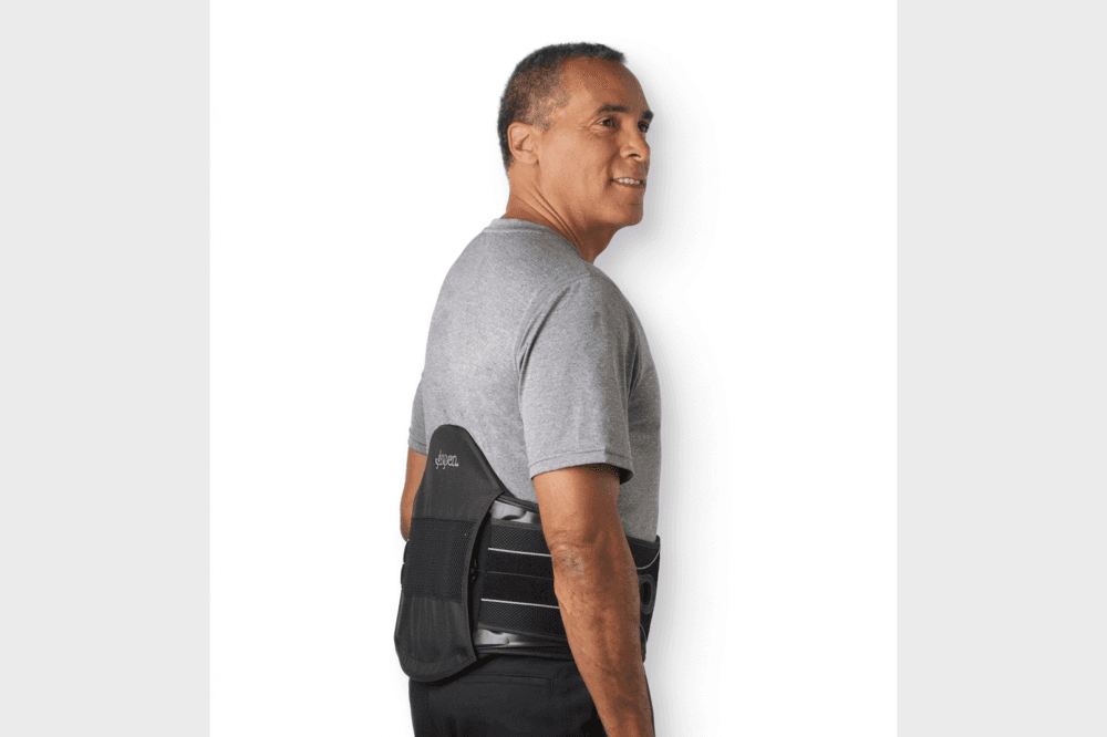Orthotic specialist explaining medical back brace options including custom spinal braces and orthopedic support devices