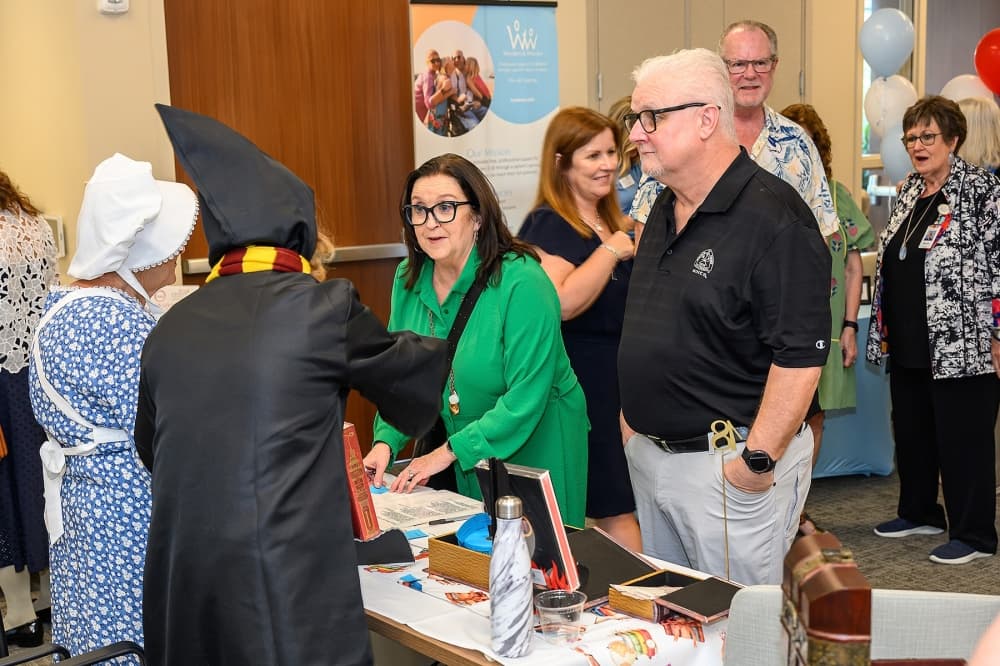 people in costume meet and greet at an event