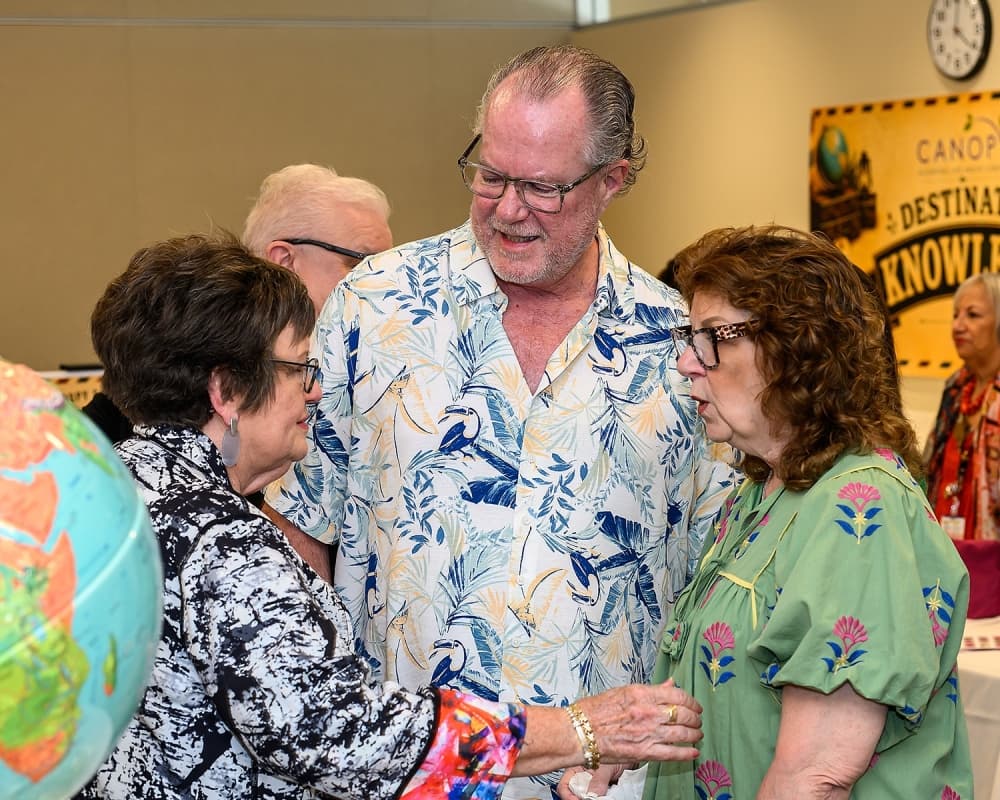 three people talk at a Canopy event