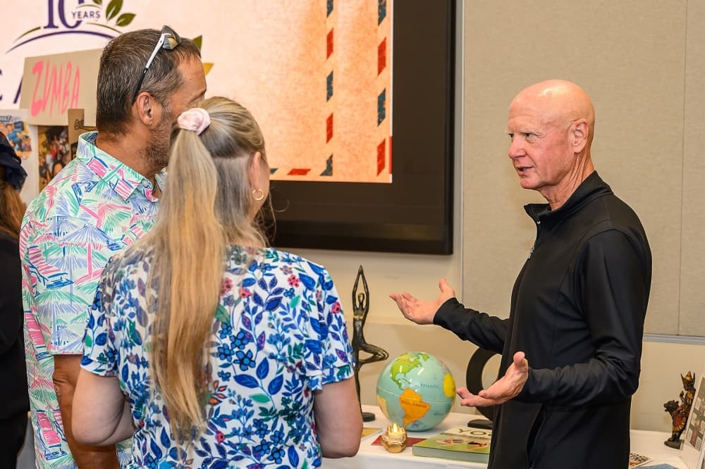 three people talk at a Canopy event