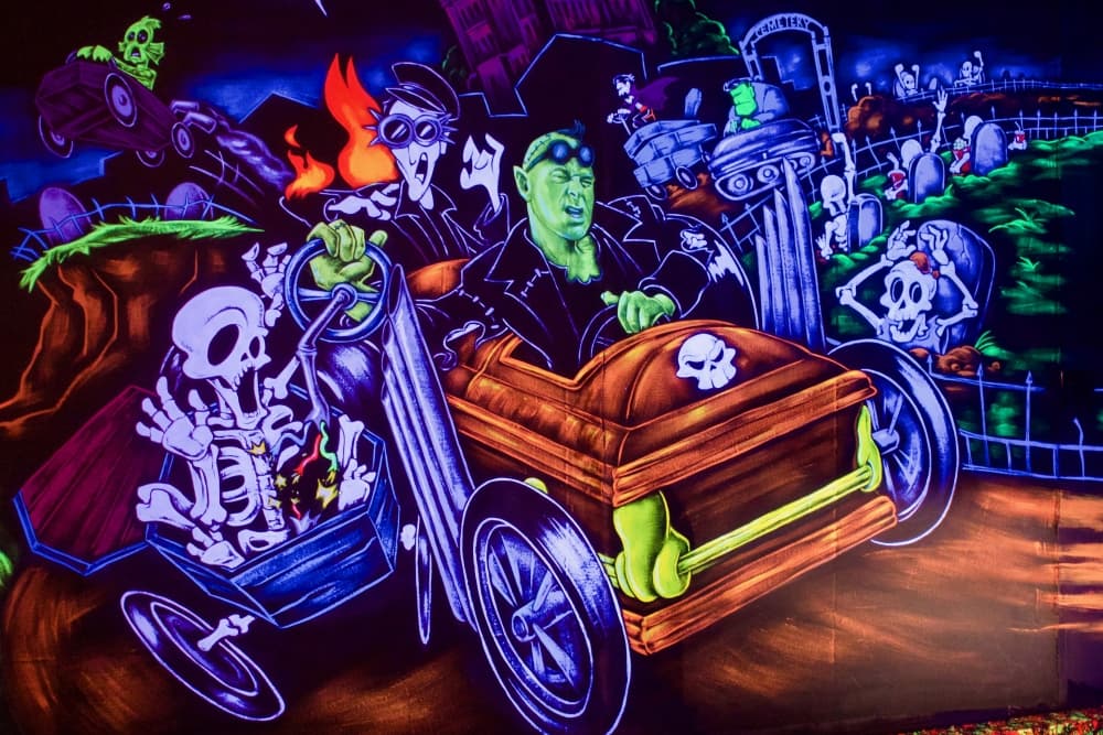 Some of the artwork through the venue references elements of Denton culture and events, like the coffin races held every October. (Adam Doe/Community Impact)