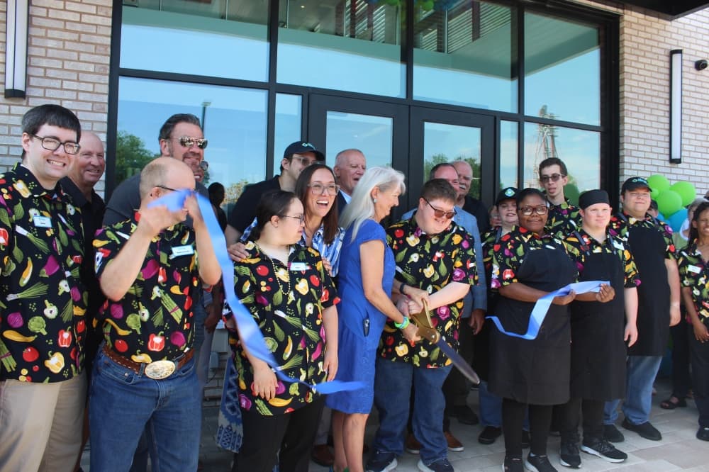Hugs Cafe Inc. celebrates new headquarters opening in East McKinney