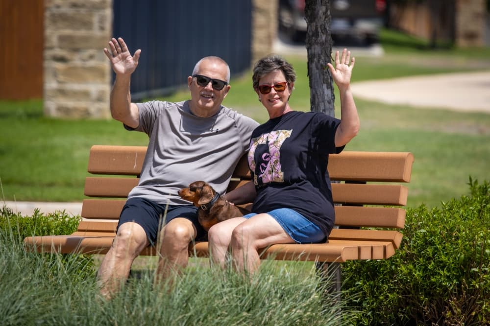 people waving from park bench in a neighborhood in new braunfels