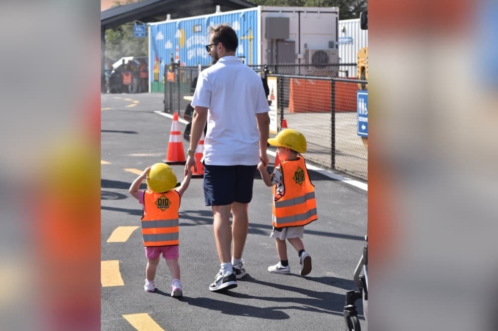 Dad walking with kids 