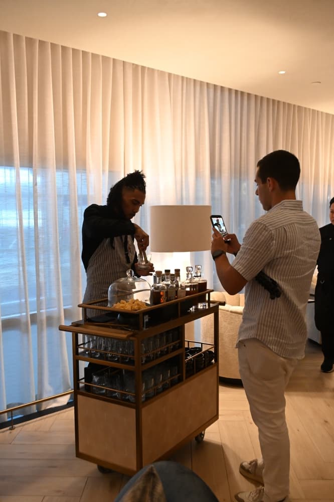 A whiskey cart inside the whiskey lounge has a bartender who will prepare a signature cocktail or pours of other Texas whiskeys.