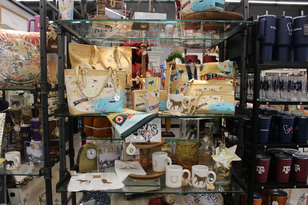 A shelf displaying artisan-made purses and accessories 