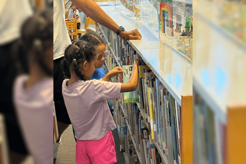 children choosing books at the bastrop public library
