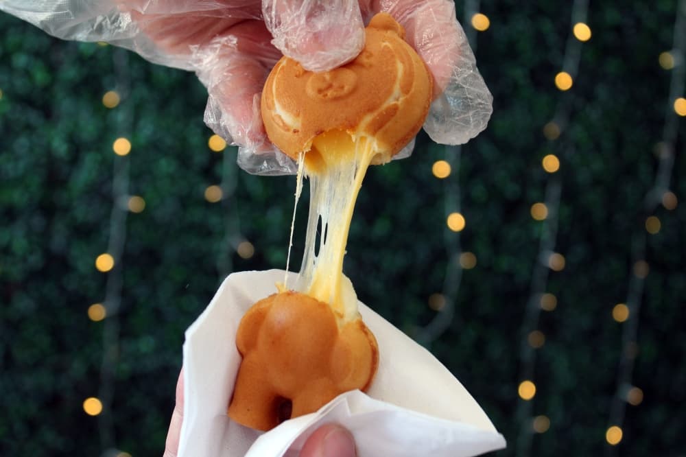 mozzarella and cheddar cheese Sweet Bear being pulled apart