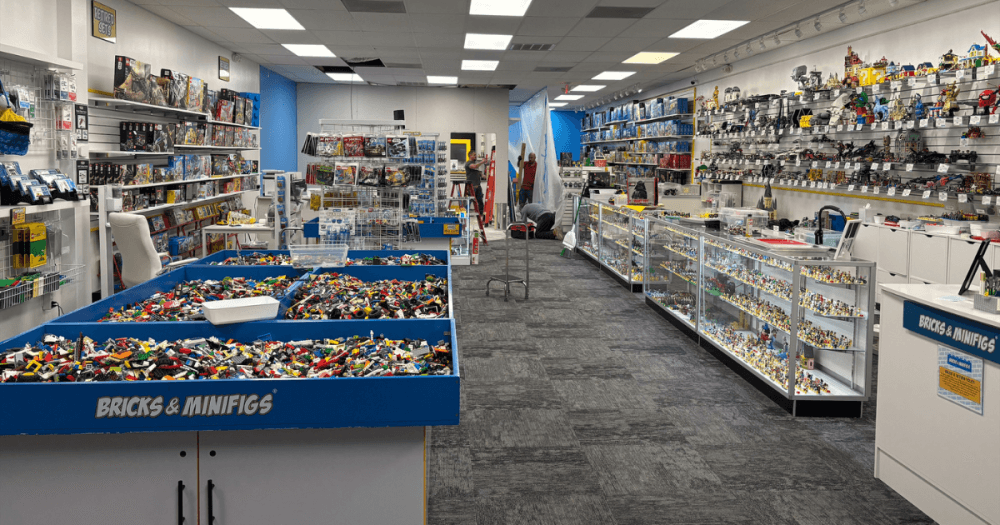 Shelves filled with retired LEGO sets, rare LEGO collectibles, boxed LEGO sets and LEGO minifigures at Bricks & Minifigs Spring near The Woodlands.