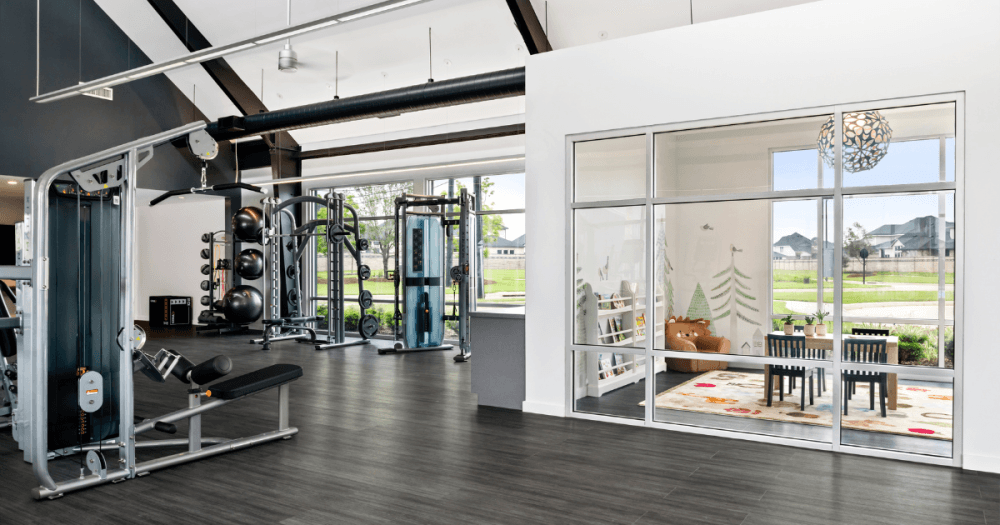 Fitness center and clubhouse overlooking the community pond at Pecan Ridge.
