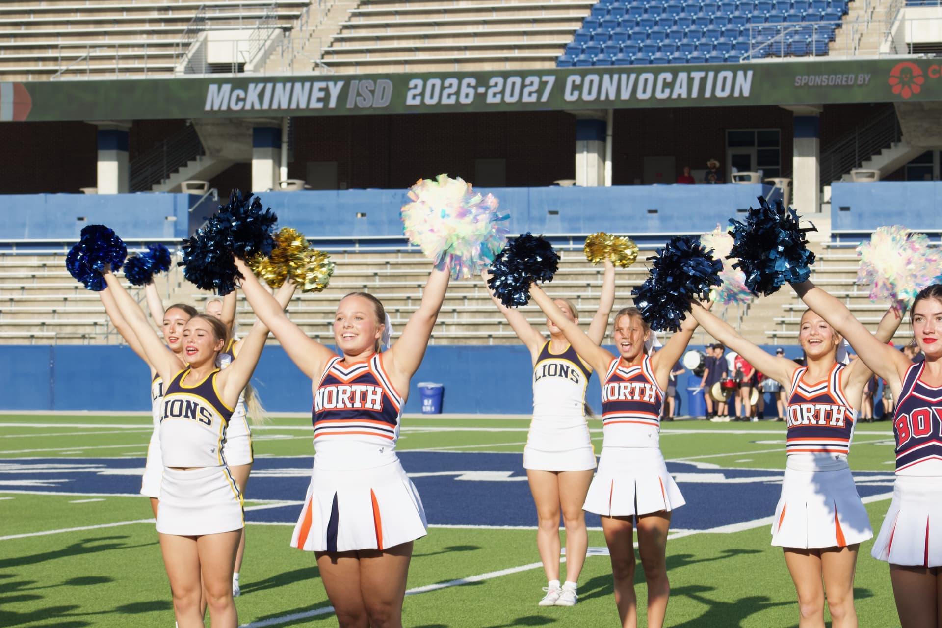 cheerleaders on a field 