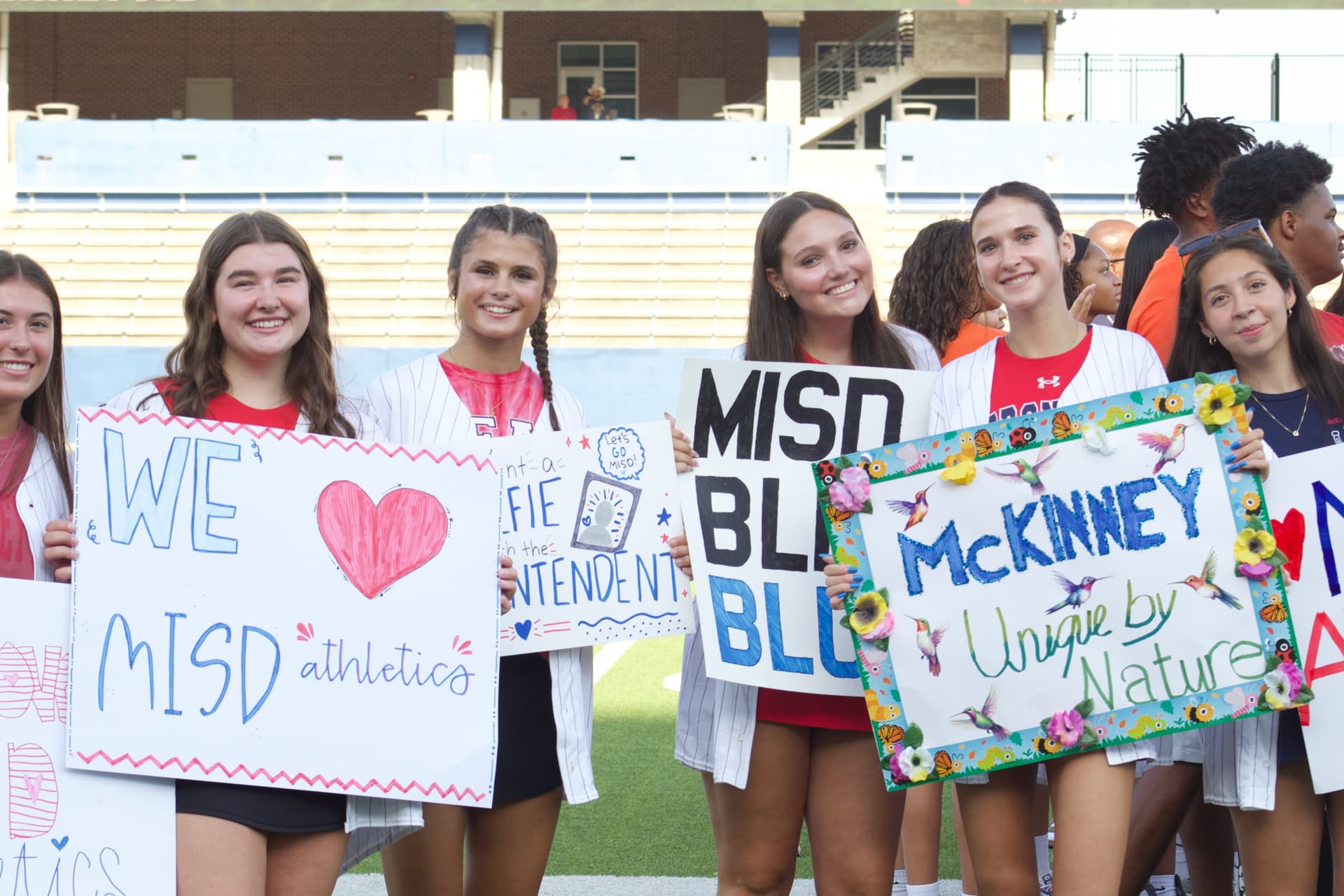 students holding signs
