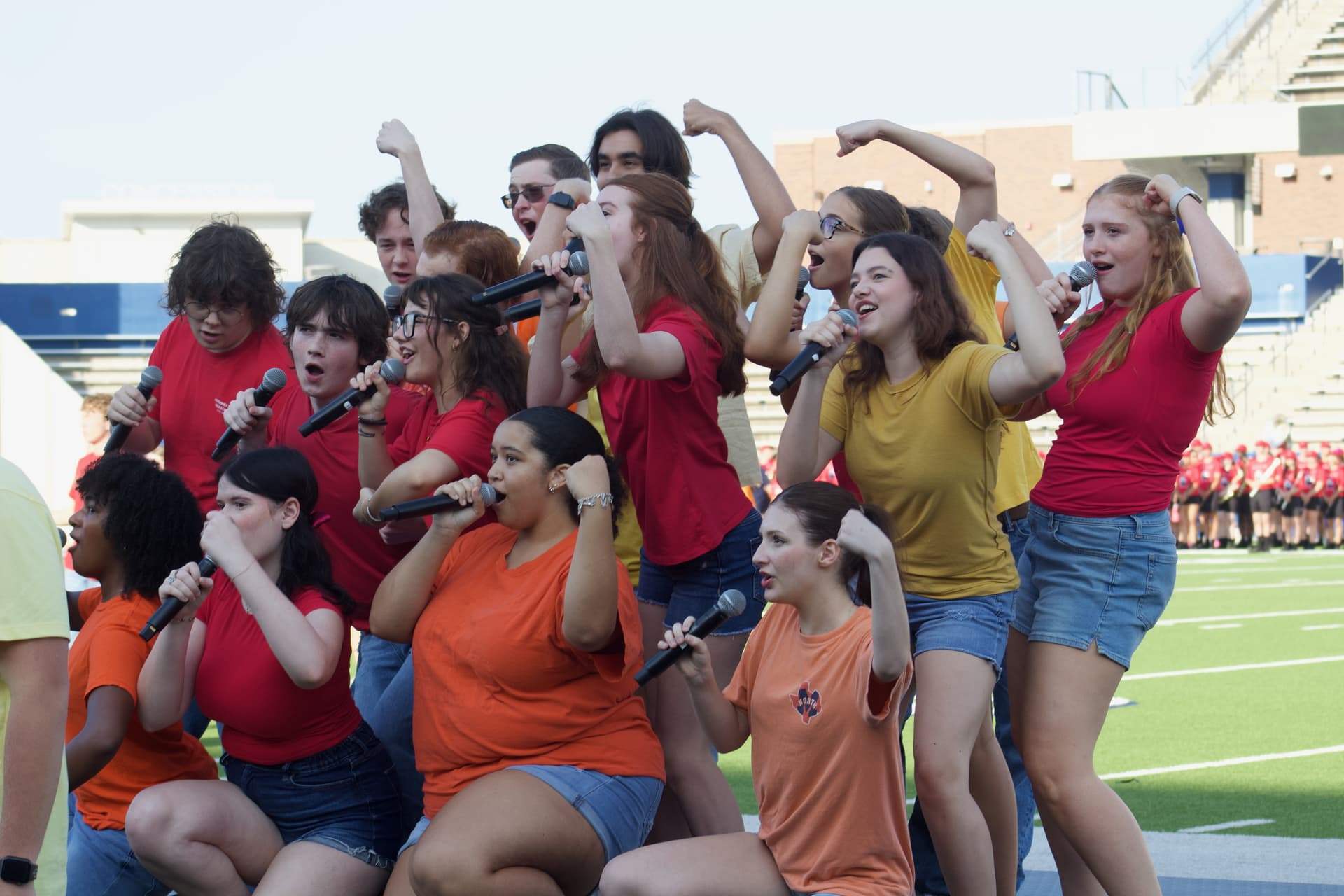 students singing on a stage
