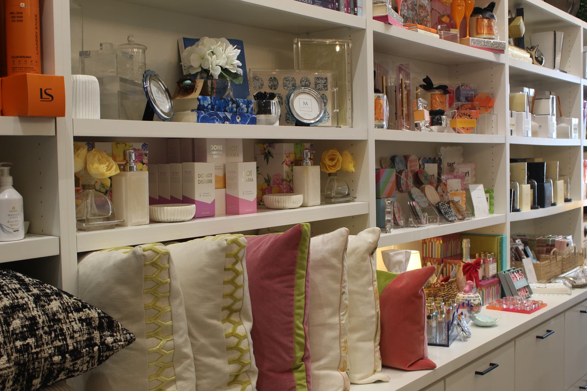 Shelves filled with a variety of items that are sold at Barbie's House.