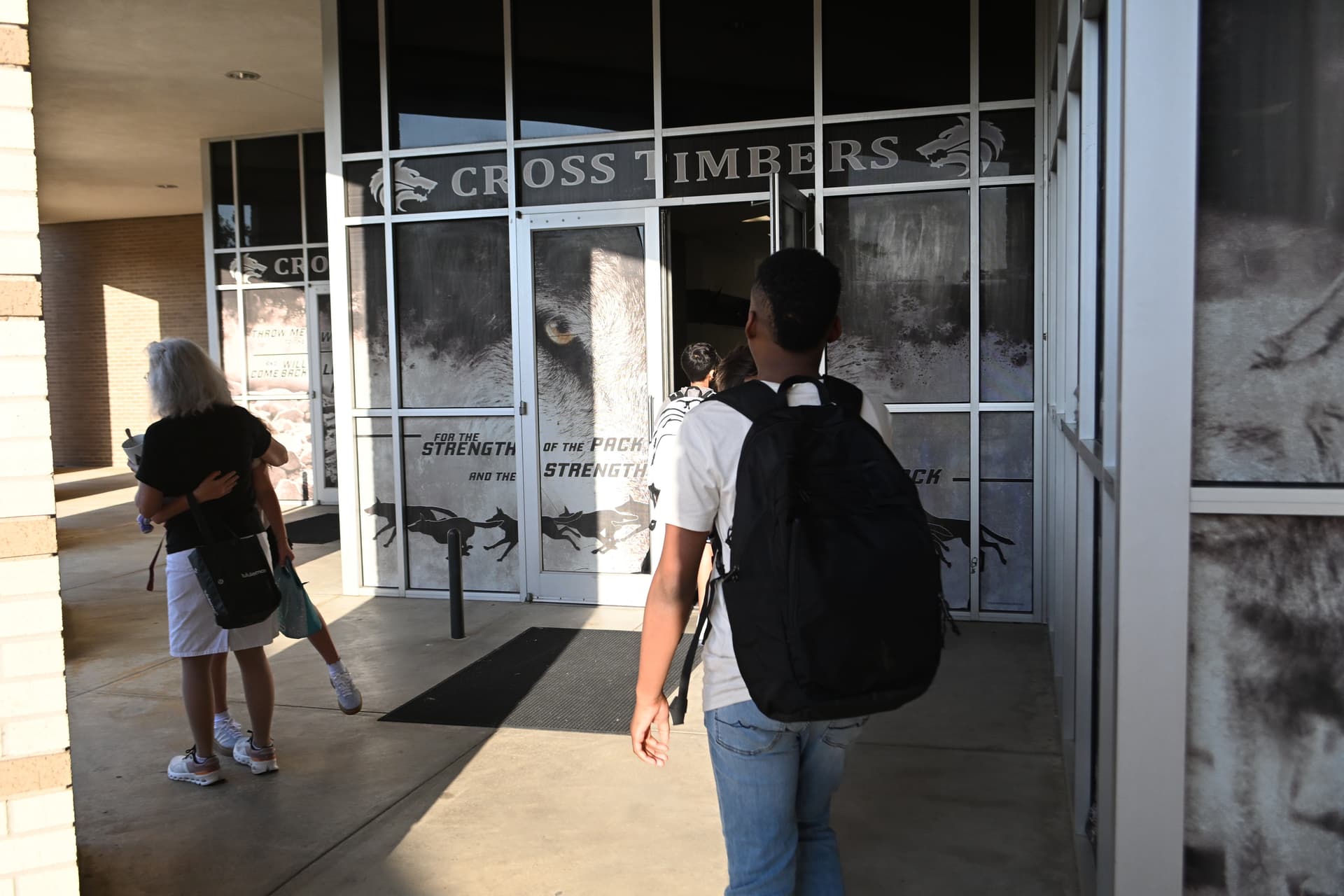 Students walk into Cross Timbers Middle School Aug. 12.