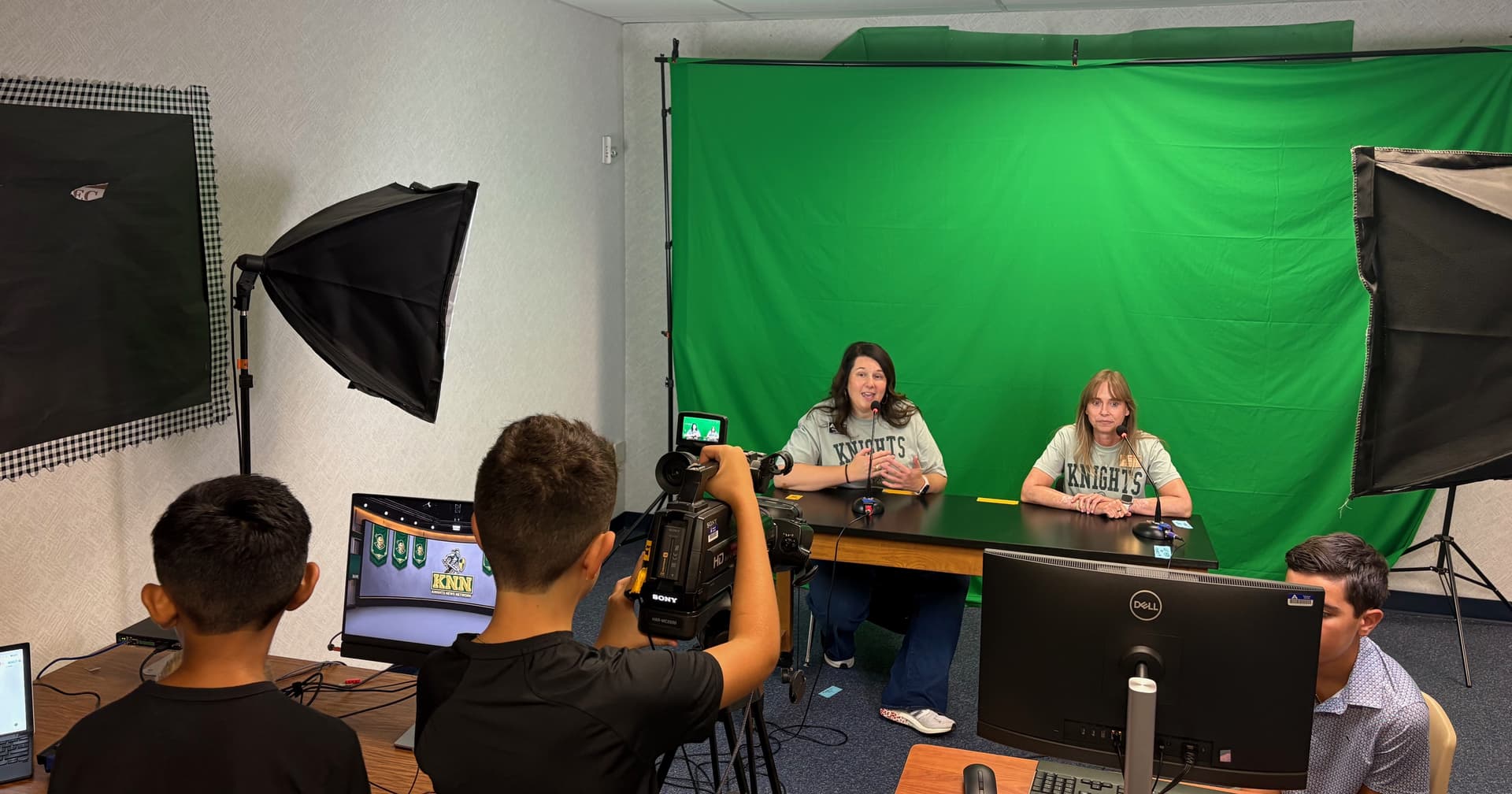 Norton Elementary School Principal Renee Nelson (left) speaks during morning announcements on the first day of school.