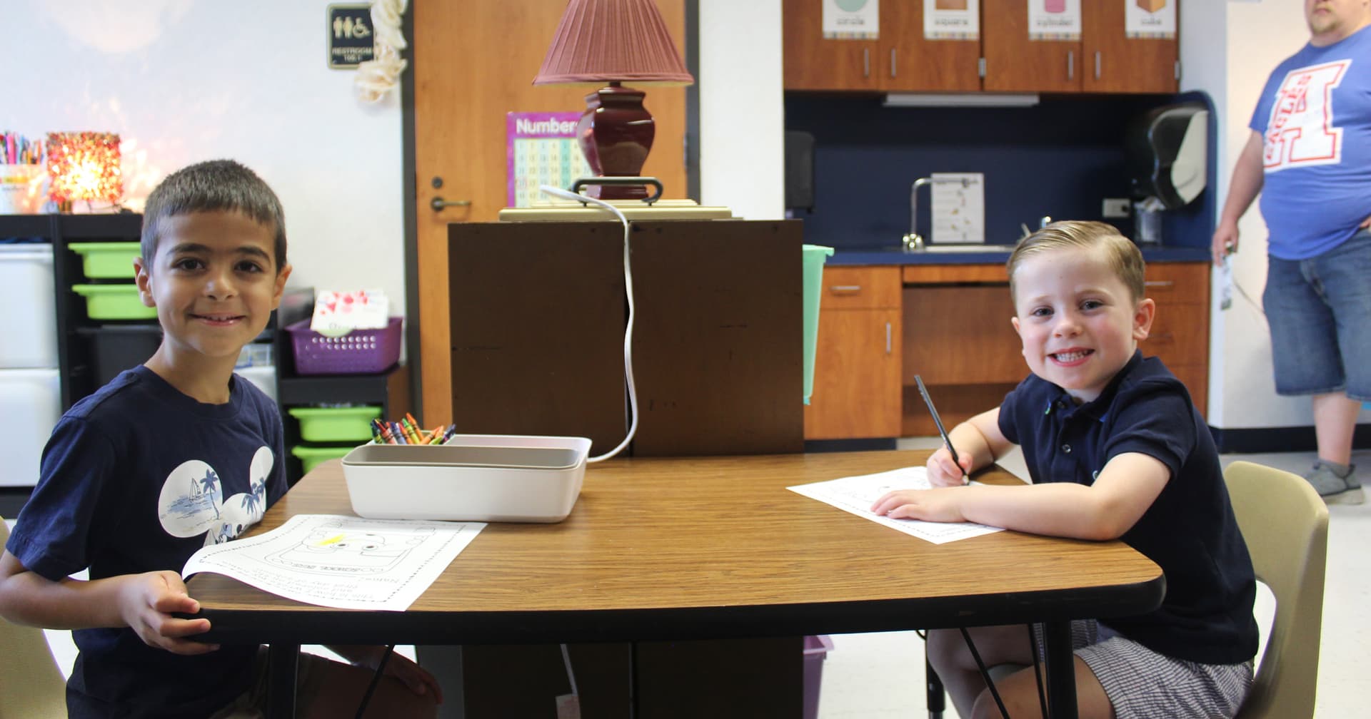 Two kindergarten students pose for a photo on Aug. 13.
