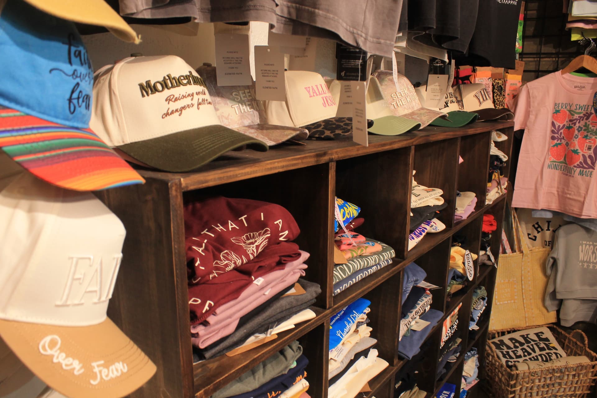 Clothing items, including T-shirts and hats, are also available. (Hannah Brol/Community Impact)