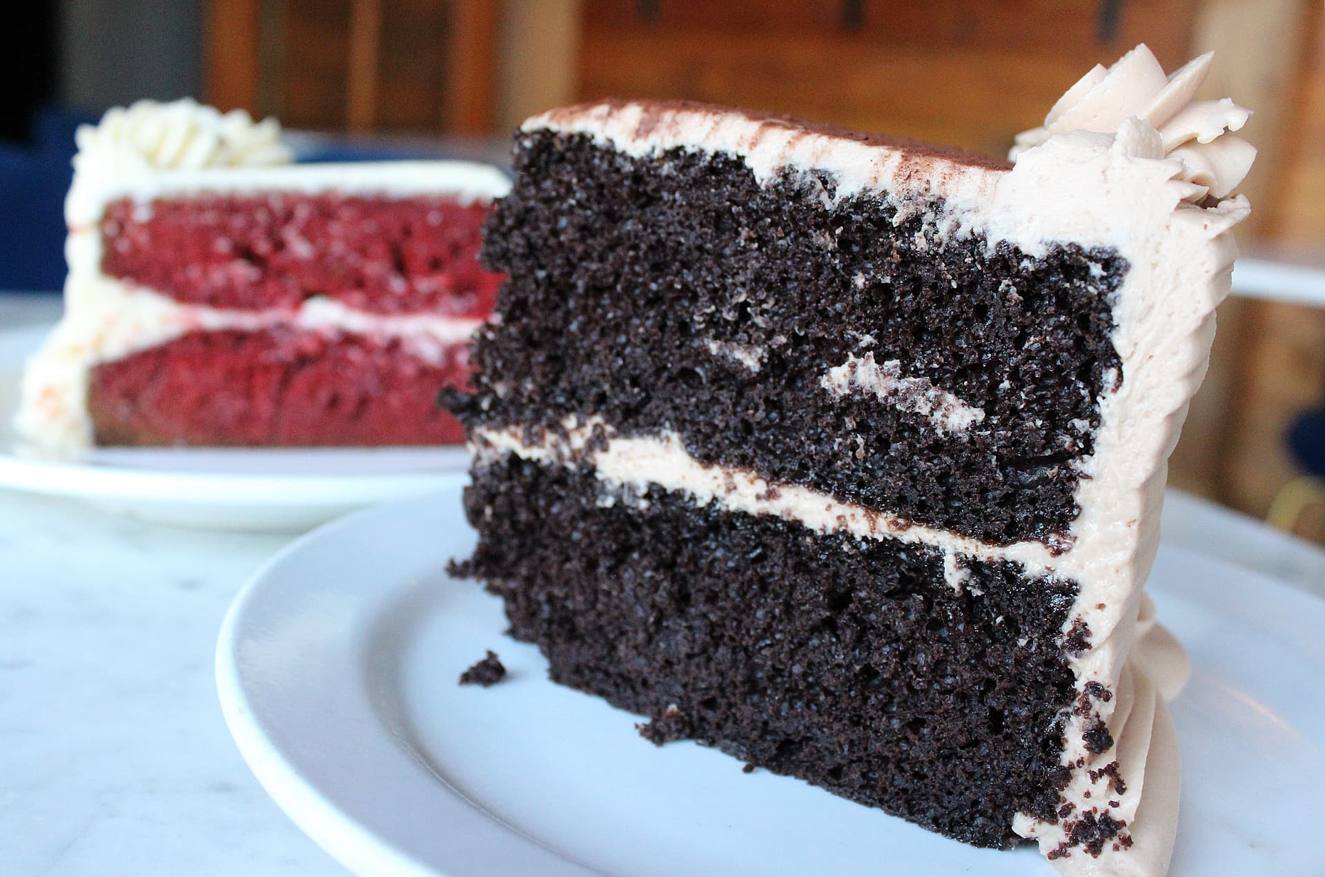 A variety of cakes, including red velvet and chocolate Kahlua, are made in-house daily. (Karen Chaney/Community Impact)
