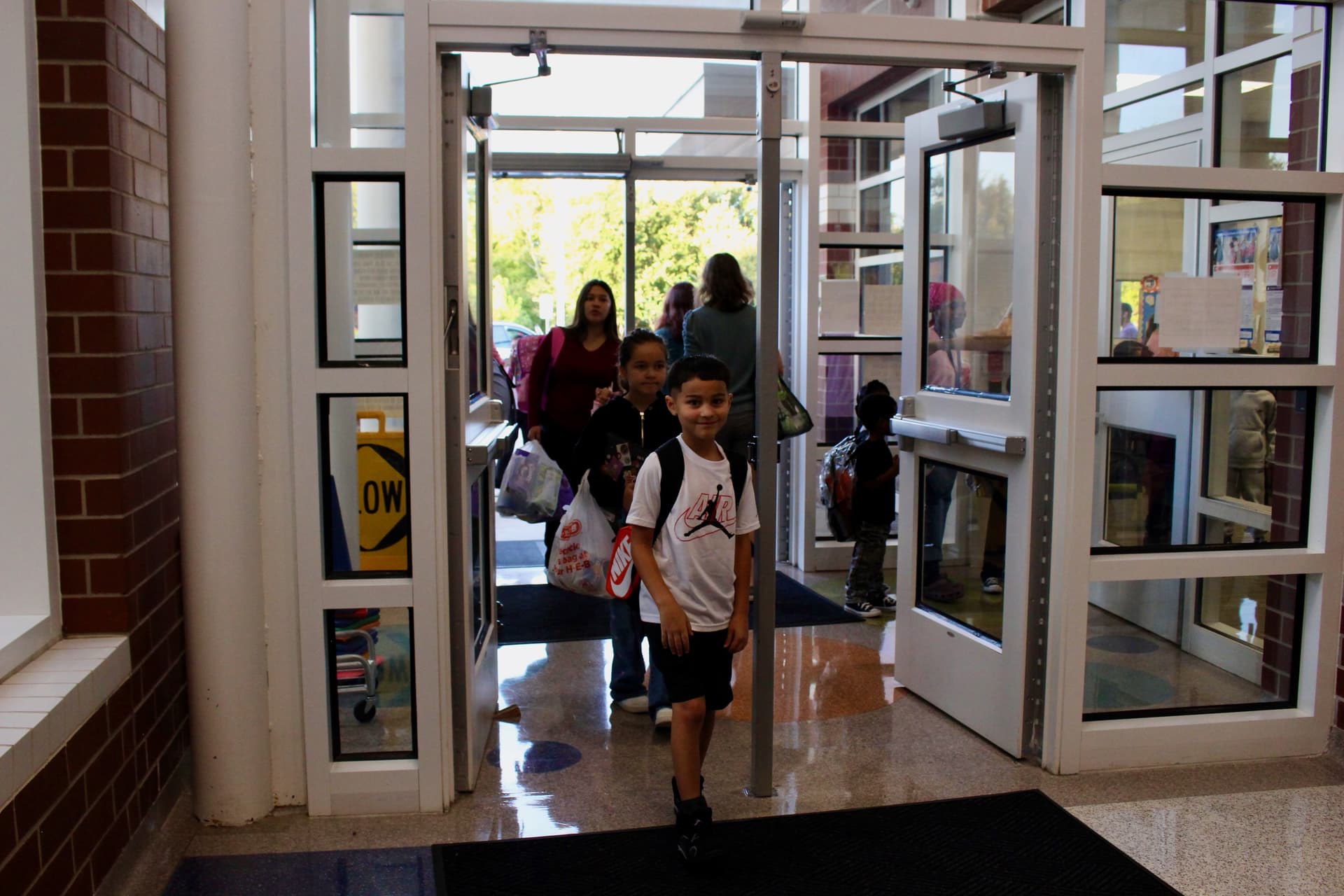 Students walk through the doors at Joe Lee Johnson Elementary on the first day of school. (Brooke Sjoberg/Community Impact)