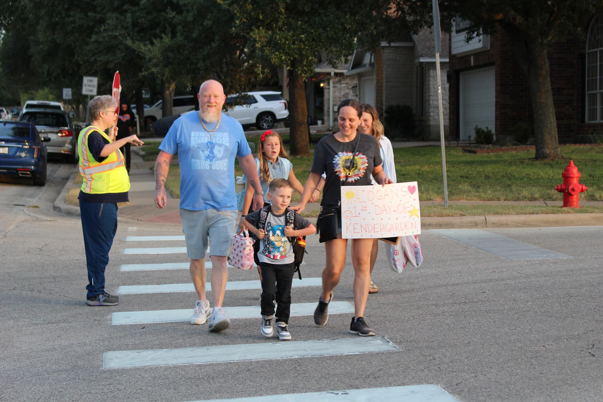 A kindergarten student walks to school on his first day. (Brooke Sjoberg/Community Impact)