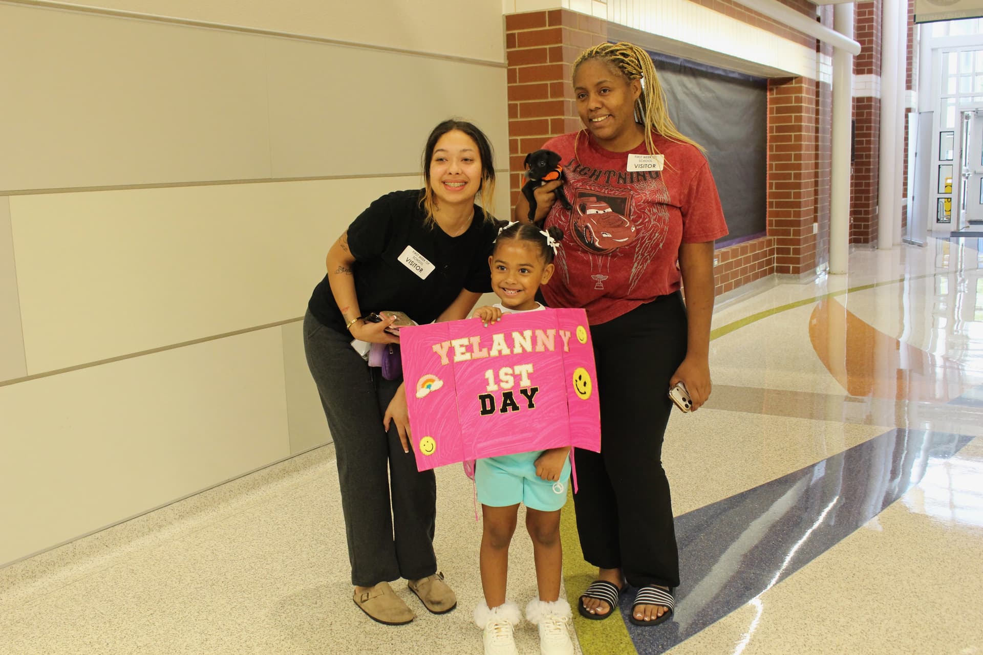 Some students brought signs for first day of school photos. (Brooke Sjoberg/Community Impact)