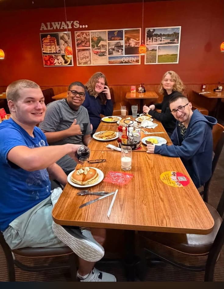 students at a table dining