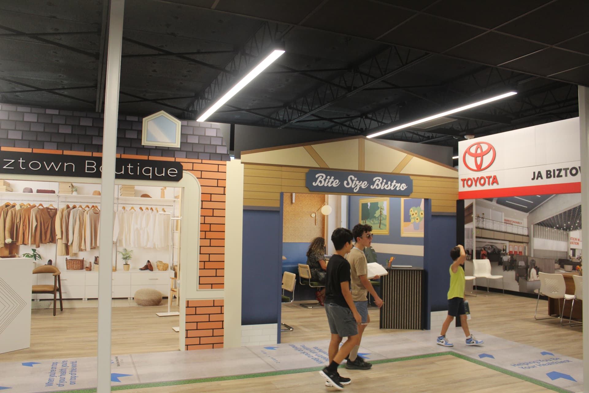 JA Biztown has a variety of storefronts, from companies like Toyota to a boutique and bistro. (Isabella Zeff/Community Impact)