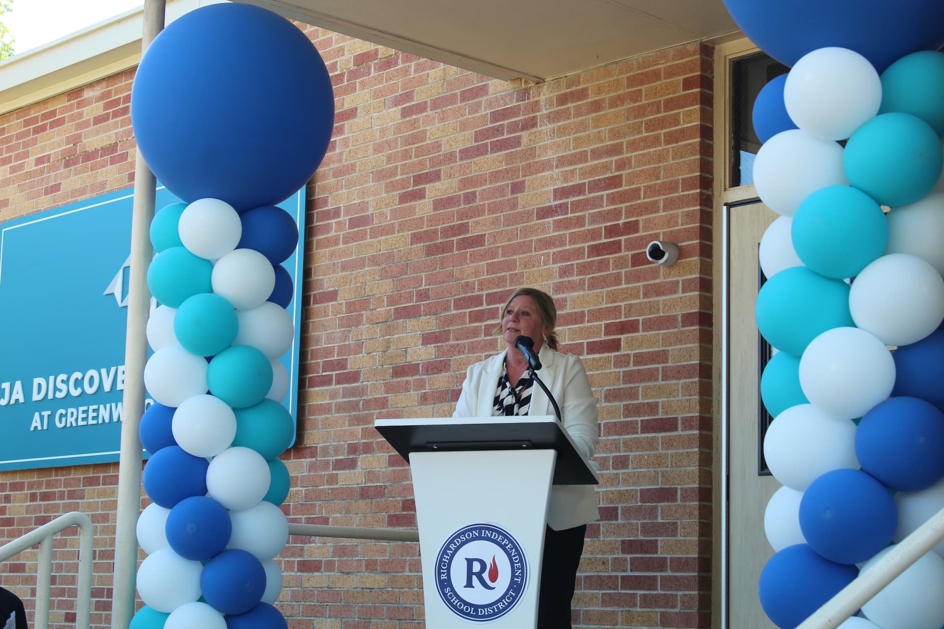 RISD Superintendent Tabitha Branum spoke at the ribbon cutting for the new JA Discovery Center. (Isabella Zeff/Community Impact)