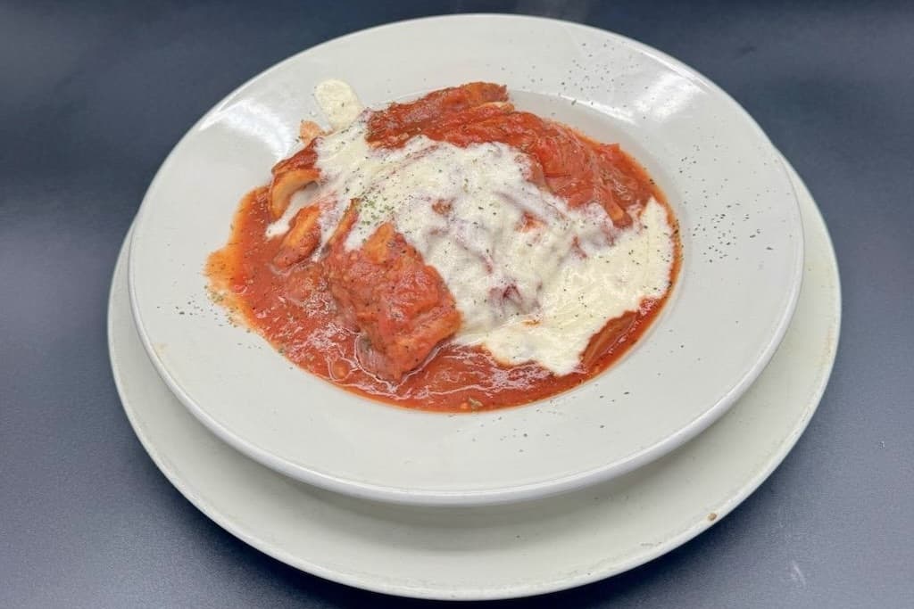 The lasagna ($15.99) is made with thin sheets of pasta, layered with bolognese meat sauce, spices, mozzarella, ricotta, cheese, tomato sauce and Pavia sauce. (Courtesy Pallotta's Italian Grill)