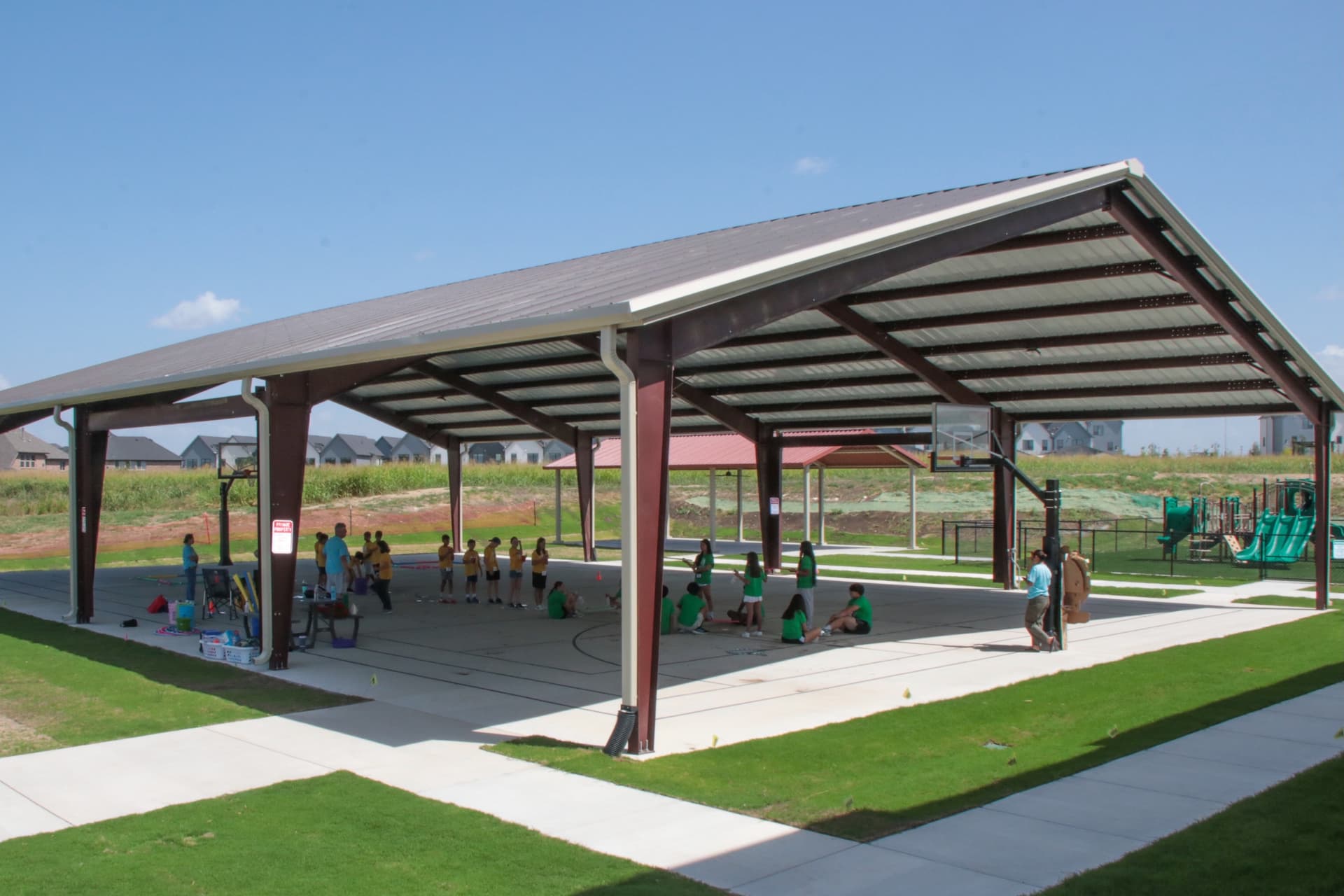 people standing in a basketball pavilion