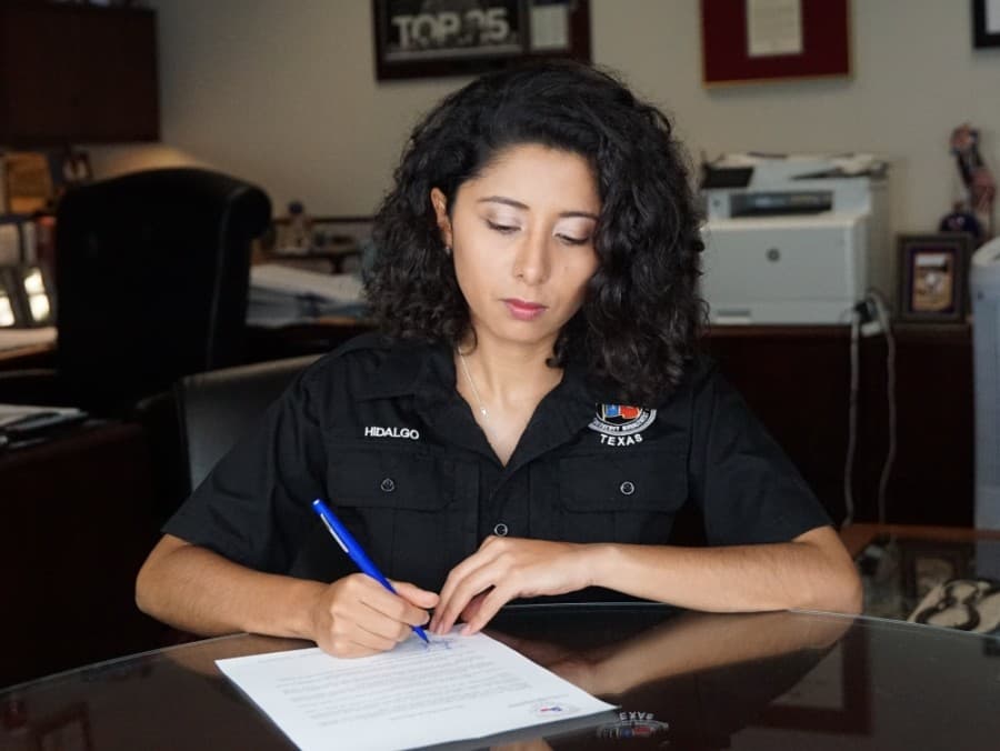 Harris County Judge Lina Hidalgo signs disaster declaration in preparation for Hurricane Laura