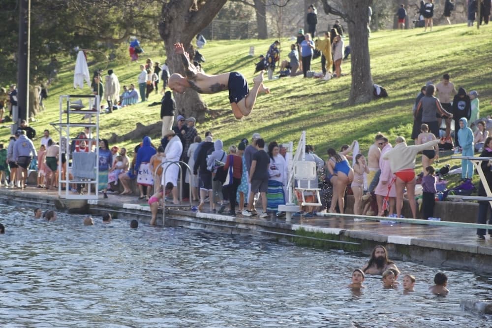 Man jumping into Barton Springs on New Years Day 2025