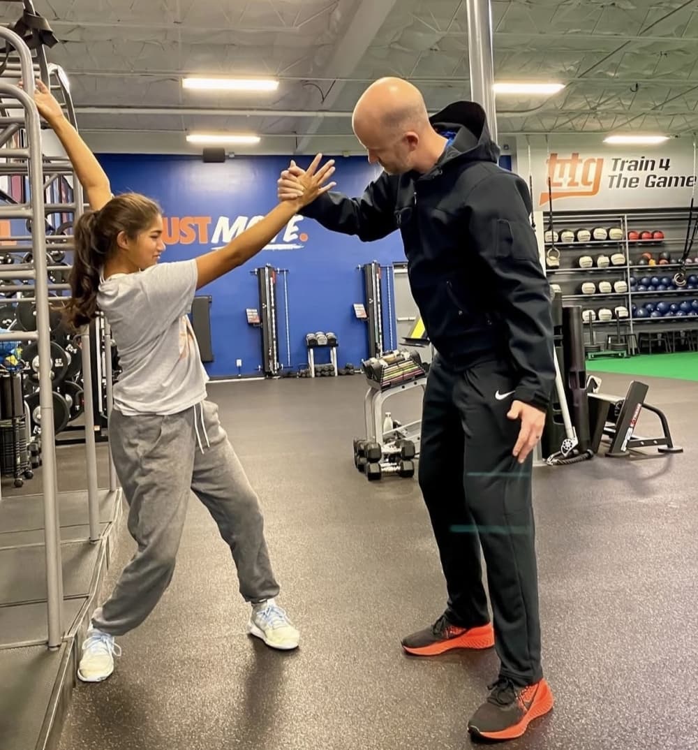 Train 4 the Game coach and client working out