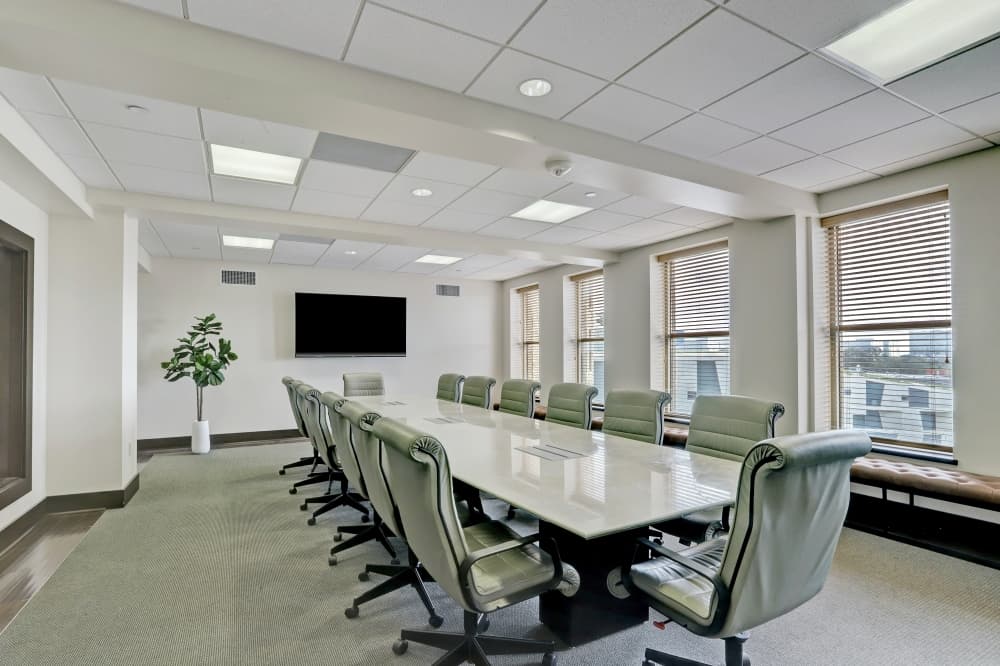 Spacious executive conference room at 5020 Montrose in Houston, featuring natural light, modern design and high-end amenities for professional meetings.