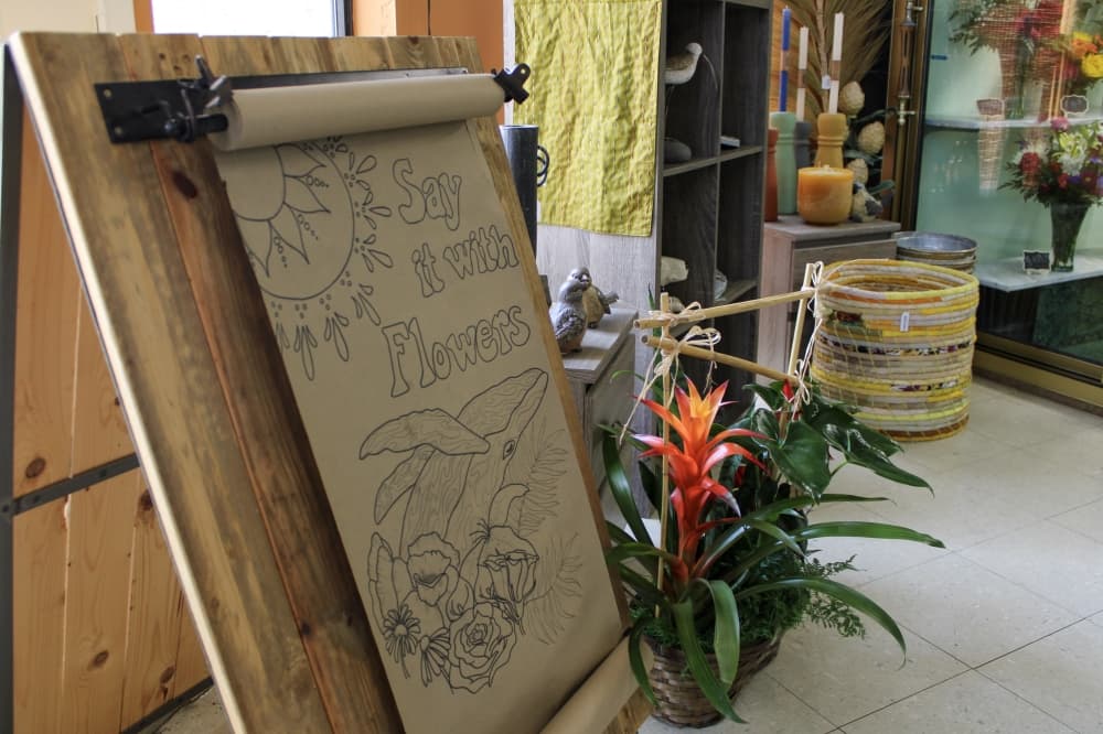 An image of a handmade poster at the front of the store.