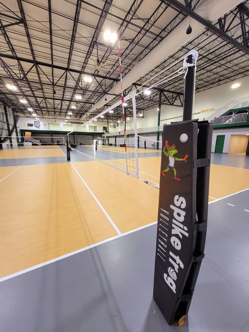 An image of a volleyball net with the business logo.