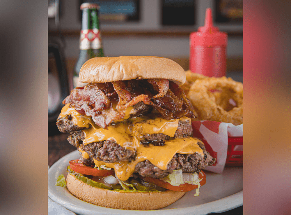 A gourmet hamburger served at a popular Tomball restaurant, highlighting the town’s locally owned dining scene.