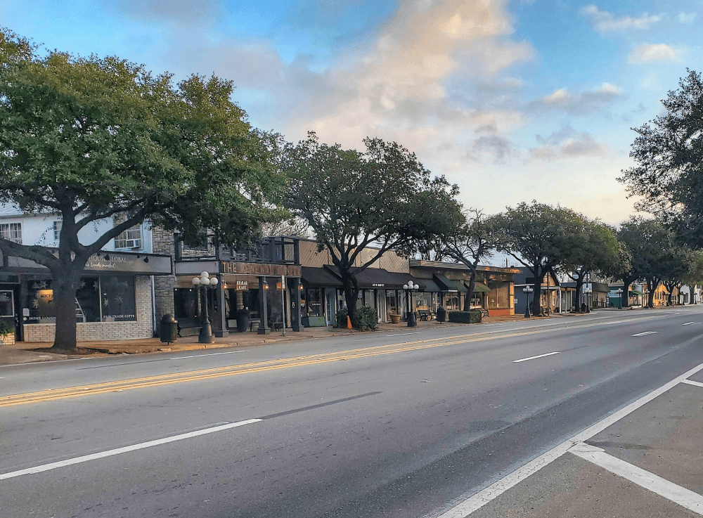 View of historic downtown Tomball, near Houston, where colorful storefronts, local shops and welcoming sidewalks invite exploration.