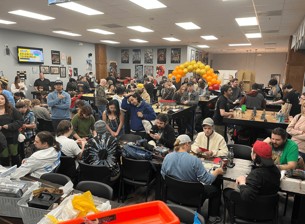 Customers playing tabletop role-playing games at The Adventure Begins in Conroe during a community board game night.