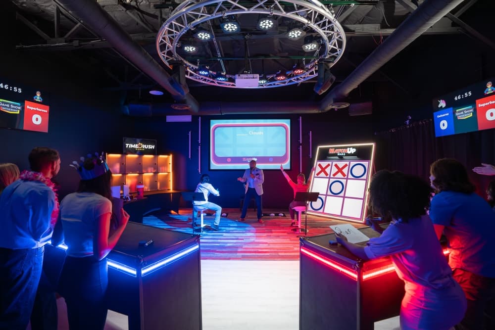 Large group celebrating at Game Show Battle Rooms, the ultimate party and event venue in The Woodlands.