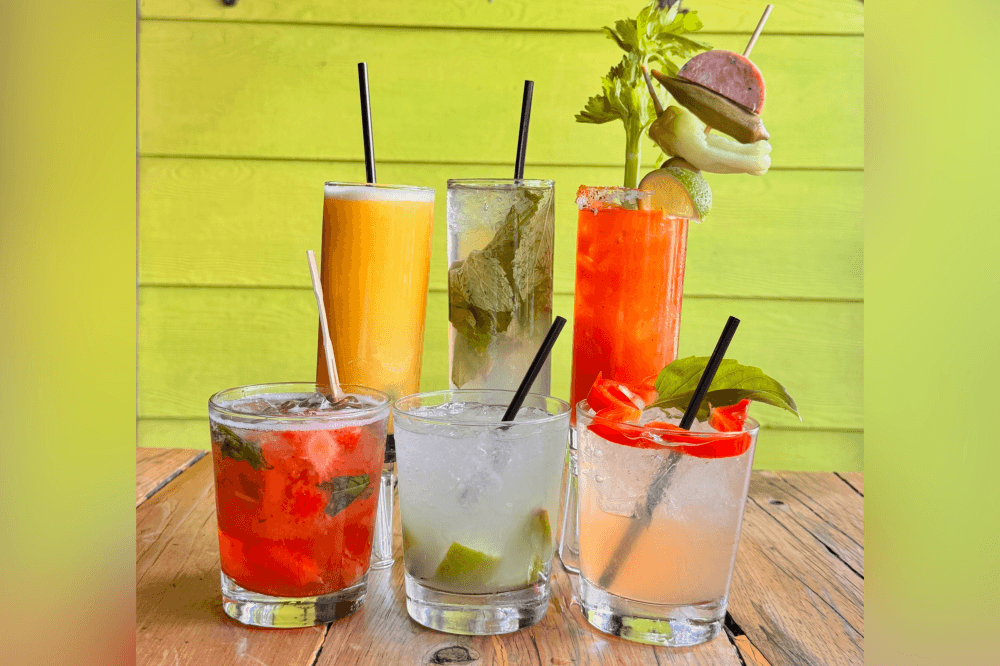 Frozen screwdriver, strawberry basil margarita, and fresh Latin dishes at Under the Volcano Houston, a local favorite for lunch, dinner, and cocktails.