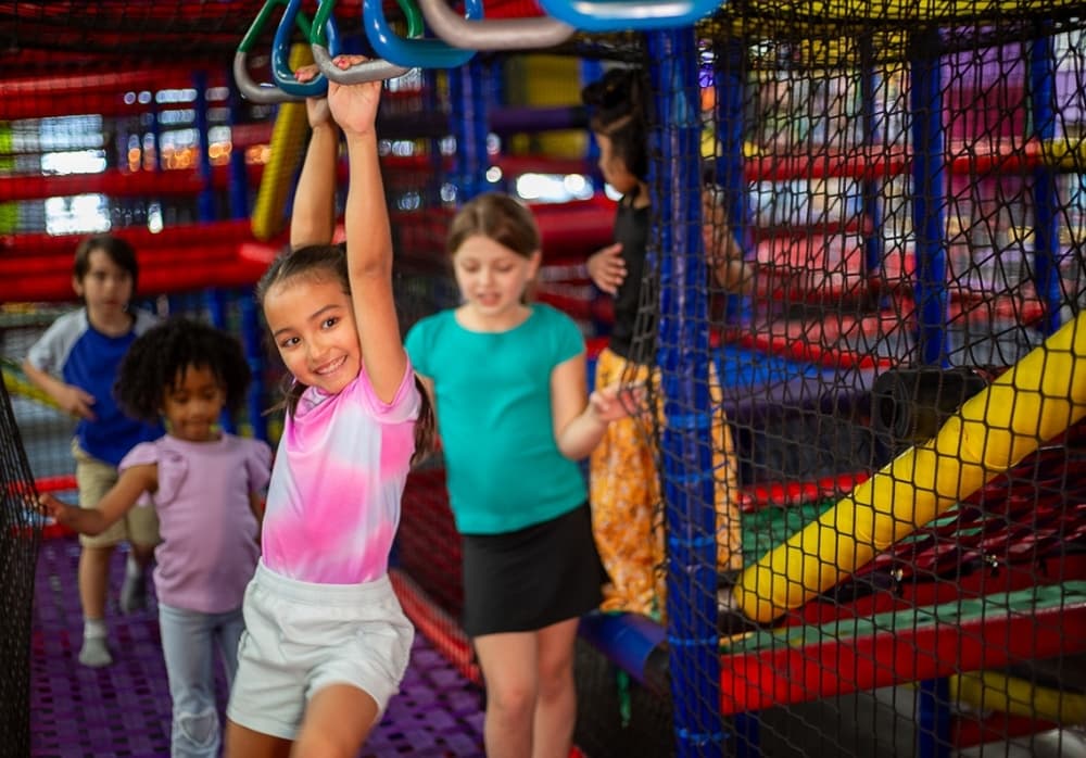 Child on monkey bars in Austin