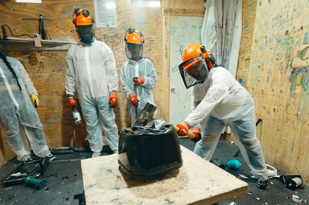 Personalized rage room and paint room experiences at Maximum Rage in Humble, Texas, where guests safely smash items, release stress, and create memorable moments for special occasions or casual outings.